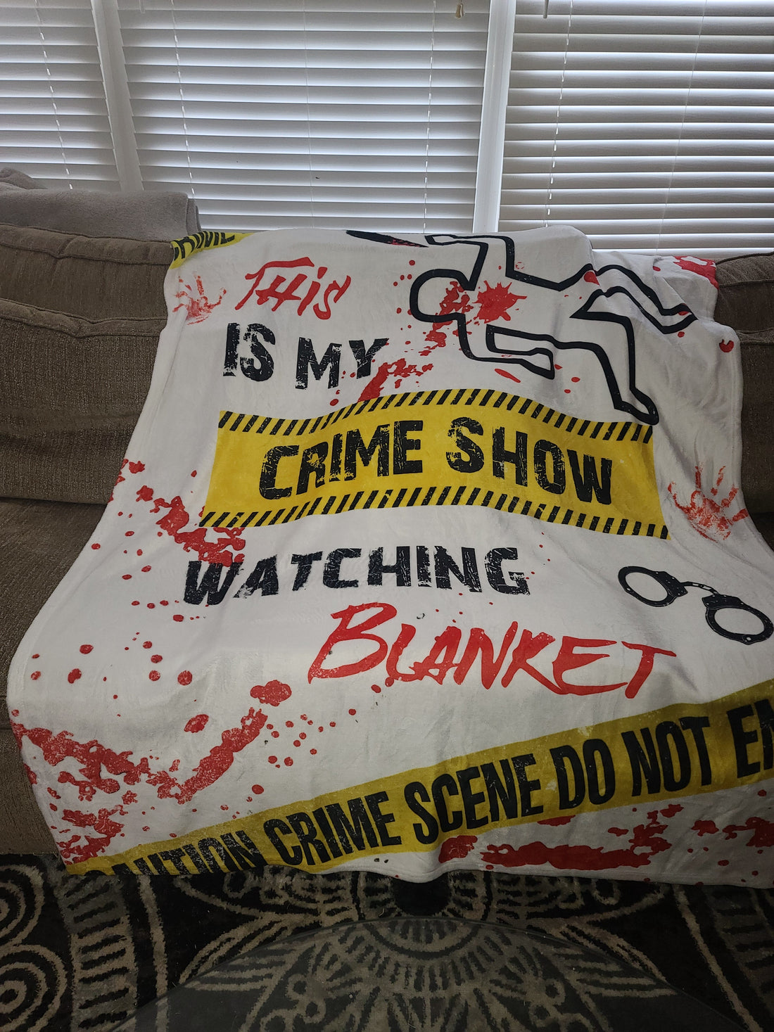 Soft velveteen Criminal Minds-inspired blanket folded on a recliner, perfect for cozy binge-watching or self-care days.