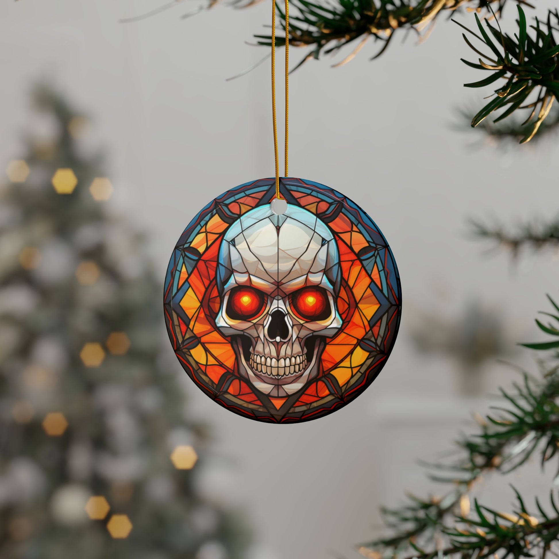 Decorative skull ornament with stained glass effect hanging on a tree branch.