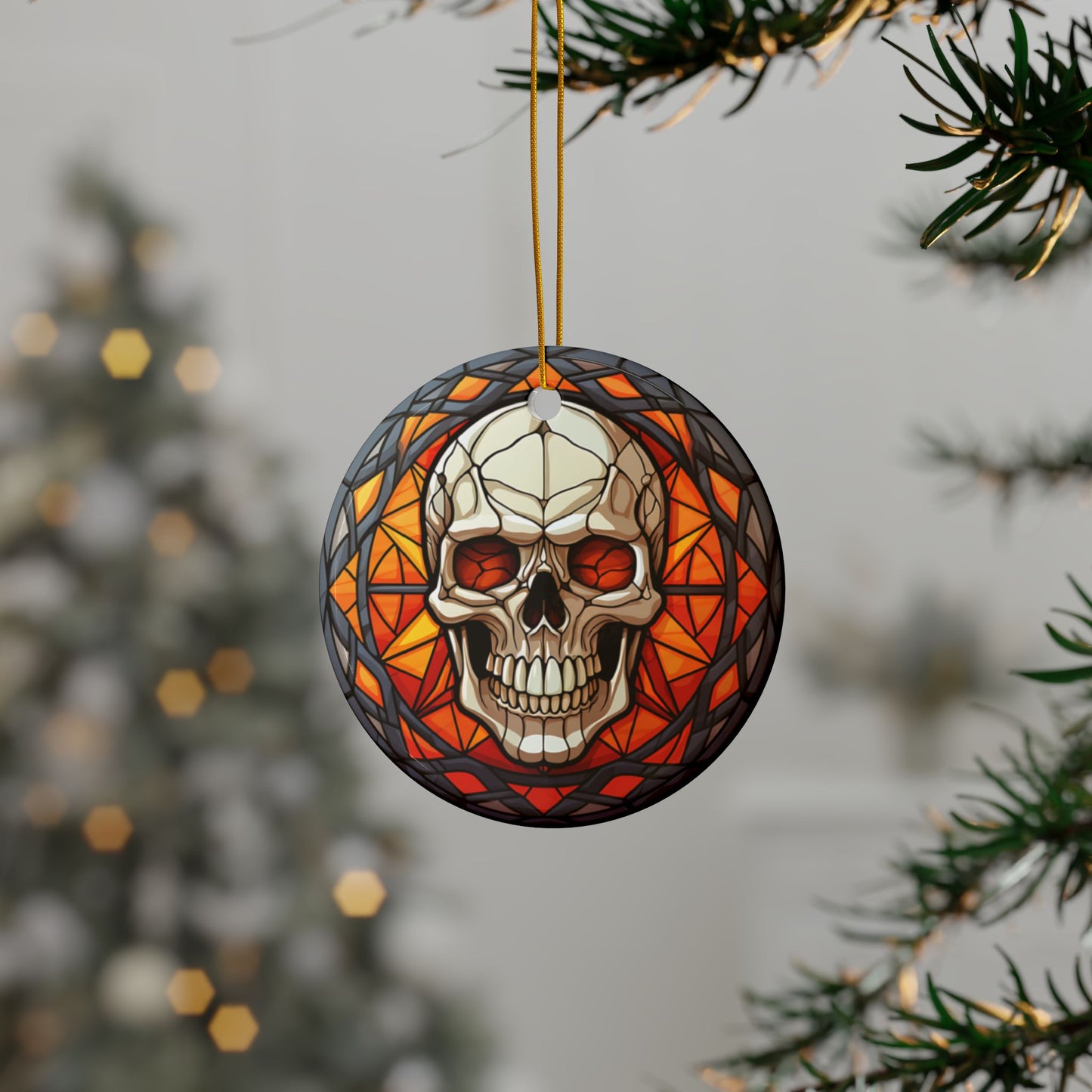Decorative skull ornament with stained glass design hanging on a tree branch.
